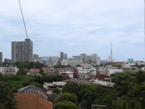 a view of a city with buildings and trees at Regent Ngamwongwan Hotel in Nonthaburi