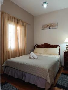 Giường trong phòng chung tại Villa Kalymnos Sea View