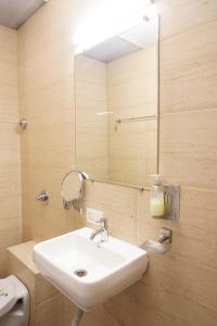 Ένα μπάνιο στο Executive Hotel Pearl Inn