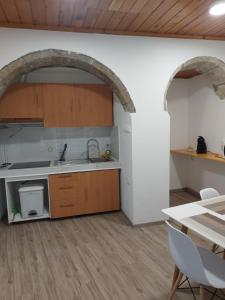 a kitchen with a sink and a counter top at Casa Flor de Laranjeira in Sanguinho