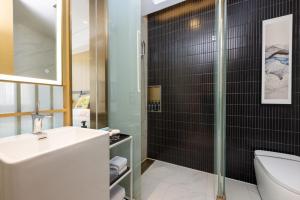 Ένα μπάνιο στο Jinyi Hotel Baotou Rare Earth High-tech Zone +6 φωτογραφίες