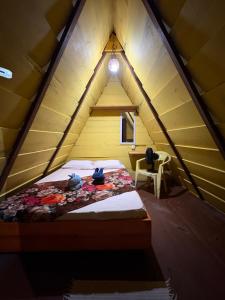 Postel nebo postele na pokoji v ubytování Camping Gnomo Místico + 23 fotografií