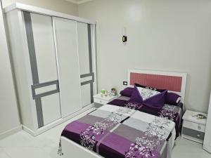 Postel nebo postele na pokoji v ubytování signature house Luxor