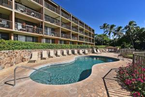 a swimming pool in front of a hotel at Maalaea Banyans 203 · MBN 203 OceanFront 1BD Amazing Ocean Views in Wailuku