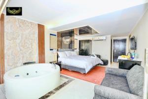 a bedroom with a bed and a tub in a room at Giza Inn Comfort view in Cairo +139 photos