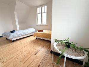 Ένα ή περισσότερα κρεβάτια σε δωμάτιο στο Le sympathique