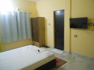 Et tv og/eller underholdning på Jeetaverse Hospitality Services Limited