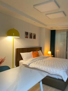 Ένα ή περισσότερα κρεβάτια σε δωμάτιο στο 스테이 윤 써밋베이1009