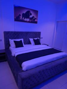 Ένα ή περισσότερα κρεβάτια σε δωμάτιο στο Hôtel Résidence Ngary