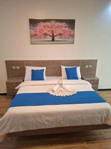 Ένα ή περισσότερα κρεβάτια σε δωμάτιο στο Hôtel Résidence Ngary