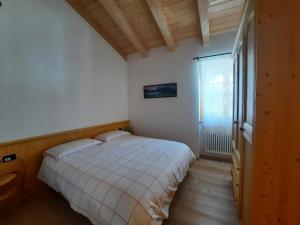 Ένα ή περισσότερα κρεβάτια σε δωμάτιο στο Appartamento la Fontana