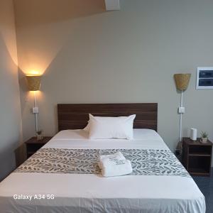 Ένα ή περισσότερα κρεβάτια σε δωμάτιο στο Hébergement Mont Adonis