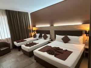 Ένα ή περισσότερα κρεβάτια σε δωμάτιο στο Hotel Stradivari