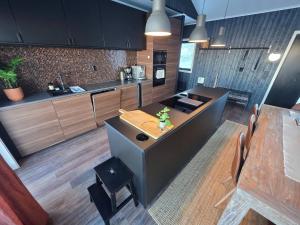a kitchen with a island with a table in it at Winter cabin with Jacuzzi in Vestby