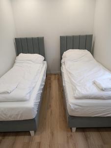 Ένα ή περισσότερα κρεβάτια σε δωμάτιο στο PokojeS12