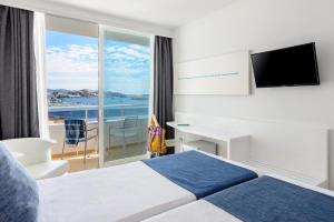 Ένα ή περισσότερα κρεβάτια σε δωμάτιο στο Hotel Vibra Algarb