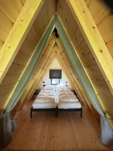 Ένα ή περισσότερα κρεβάτια σε δωμάτιο στο Parc Sonnleiten - A Chalet