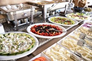 a buffet line with many different types of food at Metrohill Hotel in Istanbul