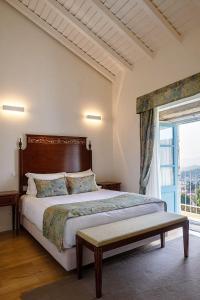 Giường trong phòng chung tại Capim Limão Country House