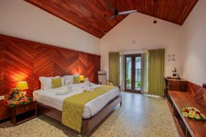 En eller flere senge i et værelse på Cardamom Village Hill Resort by EGH + 39 billeder