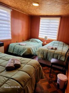 Ένα ή περισσότερα κρεβάτια σε δωμάτιο στο Hostal familiar traveltour El Campesino