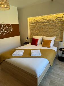 Ένα ή περισσότερα κρεβάτια σε δωμάτιο στο Gîte L'Écrin - Maison de charme 8Pers - By Primo