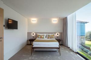 Giường trong phòng chung tại Capim Limão Country House +34 ảnh