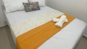 Кровать или кровати в номере A 5 min da Praia-Academia-Playground· Piscina , Ar