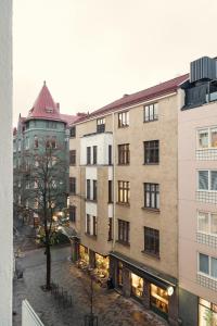 a view of a city street with buildings at Modern Studio Apt in Design District in Helsinki