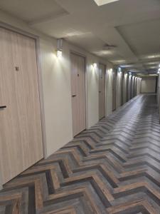 an empty hallway of an office building with a patterned floor at Hao Chi Tao Hotel in Kaohsiung +5 photos