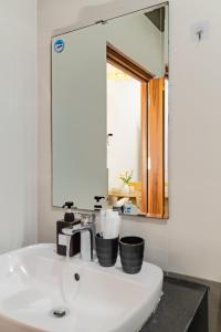 a bathroom with a sink and a mirror at Sóng homestay 4 - The spacious house - In the Prime location in Da Nang +124 photos