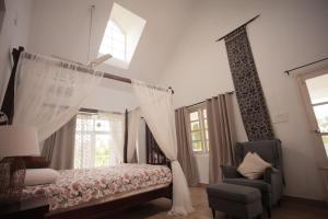 Giường trong phòng chung tại Palliath House by ELIVAAS