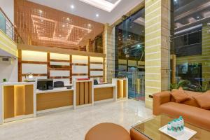 a living room with a couch and a table at Hotel Ambience Just Near New Delhi Railway Station And Connaught Place in New Delhi
