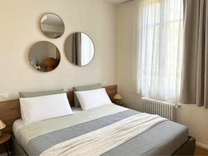 En eller flere senge i et værelse på Piazza Savoia Apartment