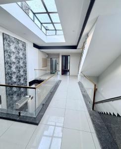 a hallway in a building with a skylight at Hotel Maria in Dera Bassi