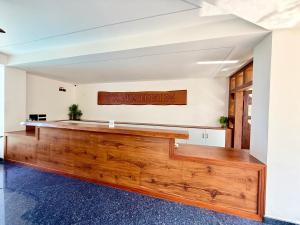 a large room with a large wooden bench in the middle at Vanaheim Resort in Vagamon