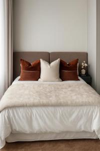 Giường trong phòng chung tại The Blyde Luxury Apartment +18 ảnh