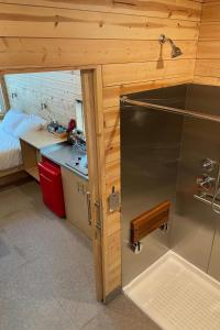 a small kitchen with a sink and a counter at Postcard Cabins Big Bear, Outdoor Collection by Marriott Bonvoy in Running Springs +47 photos