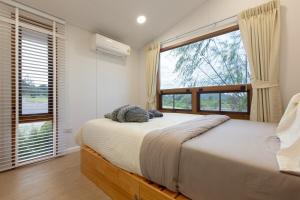 Ένα ή περισσότερα κρεβάτια σε δωμάτιο στο Muji Kaoyai At Mine Hills