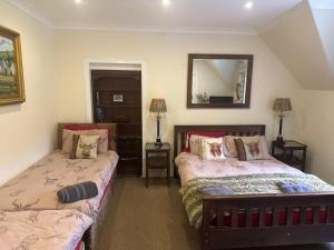 Ένα ή περισσότερα κρεβάτια σε δωμάτιο στο The West Highland Way Hotel and Retreat Accommodation