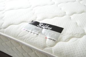a mattress with a label on top of it at remm Roppongi in Tokyo