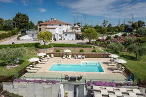 an aerial view of a house with a swimming pool at Italian Experience-La Casa di Campagna in Molino di Carassai