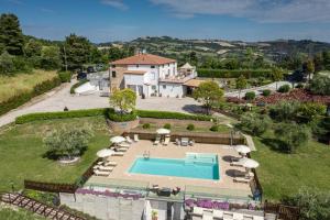 an aerial view of a house with a swimming pool at Italian Experience-La Casa di Campagna in Molino di Carassai