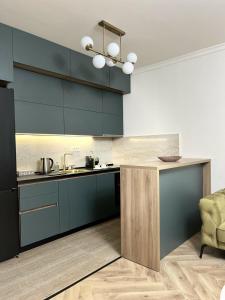 Kuchyň nebo kuchyňský kout v ubytování Stay Point Jerry - Podgorica City Apartment