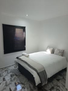 Postel nebo postele na pokoji v ubytování The Thaelo Villa