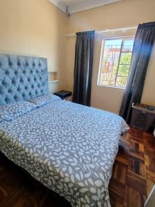 Ένα ή περισσότερα κρεβάτια σε δωμάτιο στο Saldanha Vista Heights