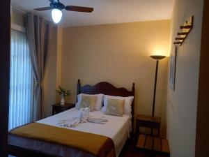 Ένα ή περισσότερα κρεβάτια σε δωμάτιο στο Apto Parque das Águas Em frente ao Pq. das Águas!! +34 φωτογραφίες