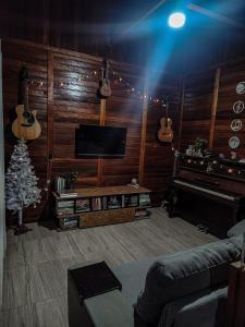 Et tv og/eller underholdning på Casa com Piscina em Balneário Piçarras