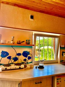 a room with a counter with a window and a counter sidx sidx sidx at The Secret Garden House in Ijevan