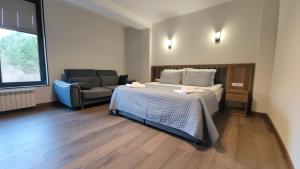 Giường trong phòng chung tại Hotel - Jodi Lare